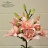 Pink lilies in a floral arrangement.