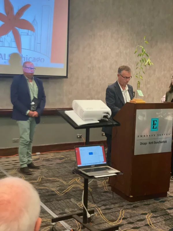 A group of people standing in front of a podium.