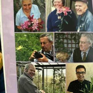 Here's an 8-word alt tag for the image: Group photo of gardeners with flowers and plants.