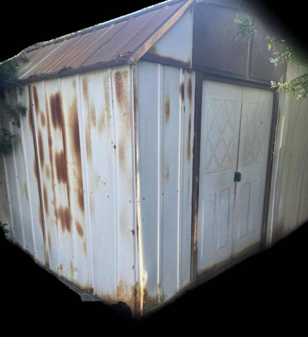 Rusty metal shed with double doors.