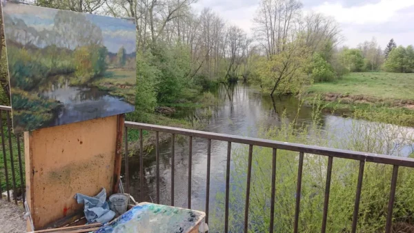 Plein air painting by riverside landscape.