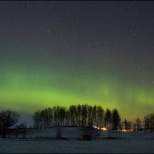 Northern lights over a snowy landscape